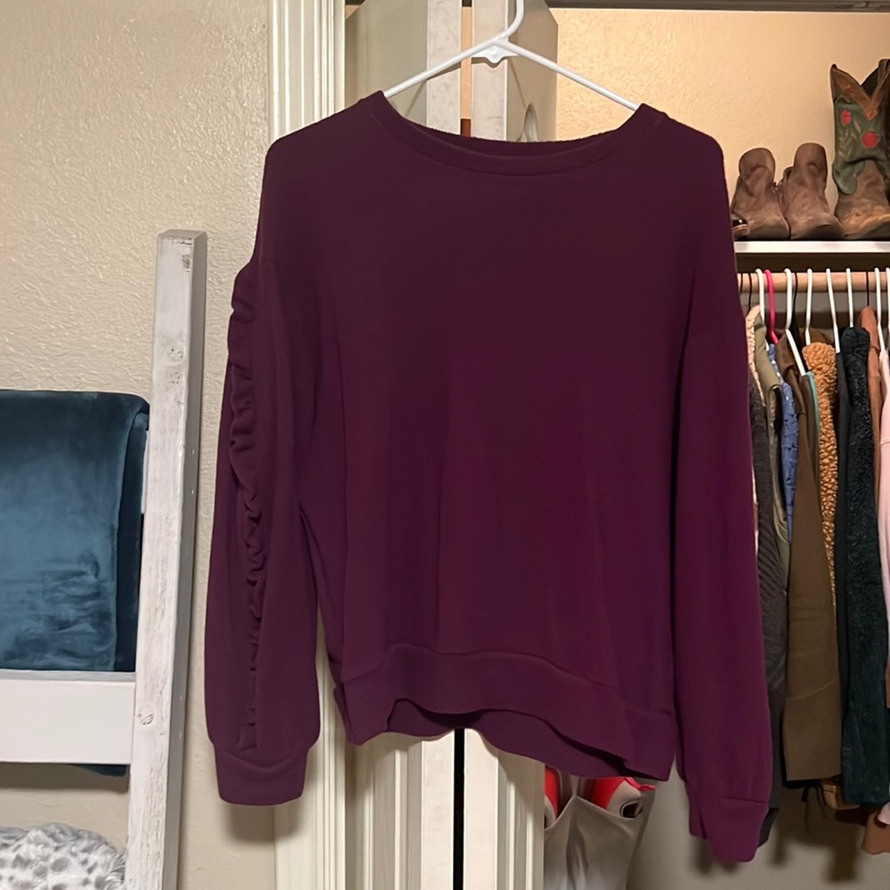 Purple sweater with ruffle detail on sleeves